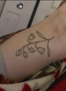 Delicate fine line flower tattoo by Lana