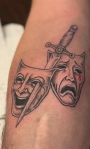 Theatrical masks tattoo design