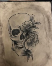 Skull and flower tattoo design
